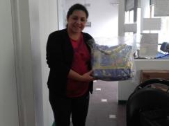 Entrega de ajuar para bebés a afiliados/as